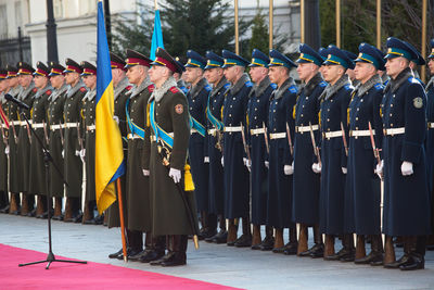 Army soldier standing with national flag