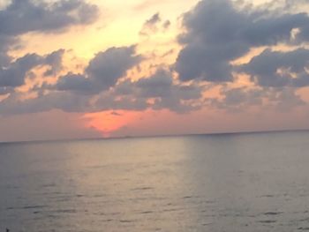 Scenic view of sea against sky at sunset