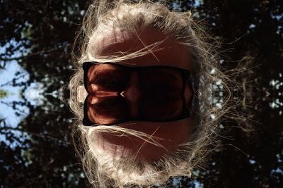 Close-up portrait of man wearing sunglasses