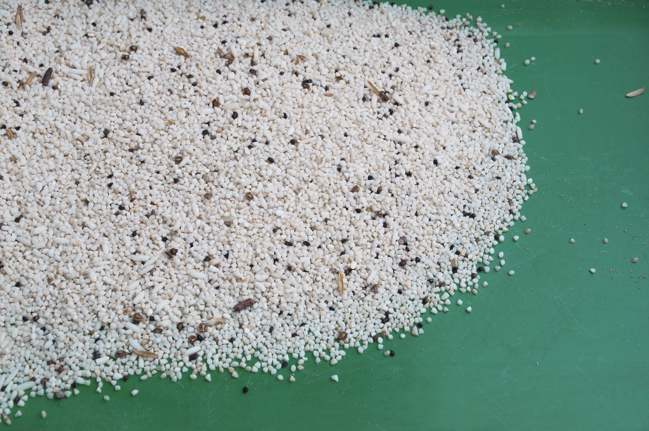 HIGH ANGLE VIEW OF WHITE WATER ON TABLE AGAINST GRAY BACKGROUND