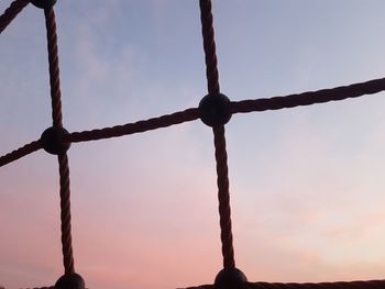 Close-up of rope against sky during sunset