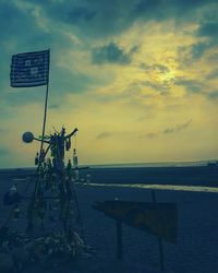 Scenic view of beach against sky during sunset