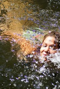 Young woman swimming in sea