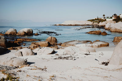 View of rocks on beach against sky