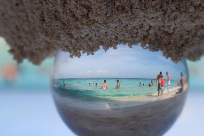 Close-up of people on beach