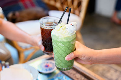 Cropped image of hand holding drink