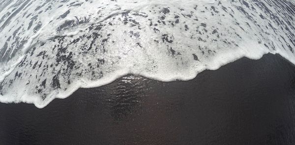 Close-up of frozen sea shore