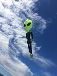 Low angle view of balloon flying against blue sky