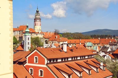 Buildings in town against sky