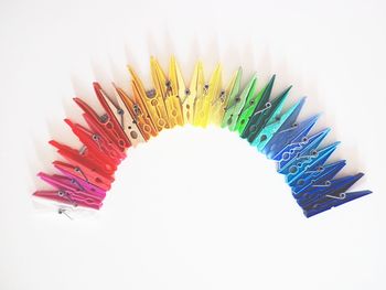 Close-up of colored pencils against white background