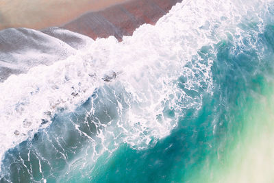 Sea waves splashing on beach