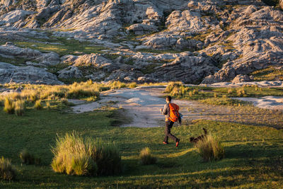 Full length of woman on rock