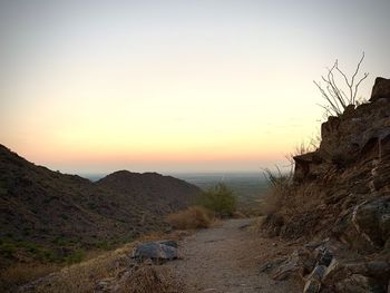 Scenic view of rocky mountains against sky during sunset