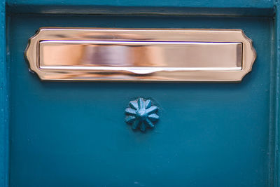 Close-up of blue metal door