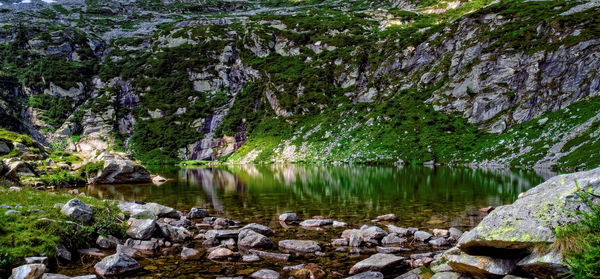 Reflection of rocks in lake