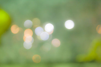 Defocused image of illuminated lights at night