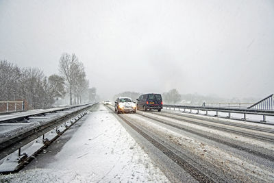 Cars driving in a snow storm in friesland in the netherlands