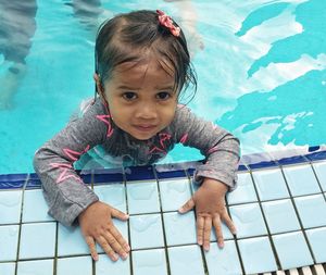 Portrait of cute girl in swimming pool