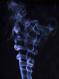 Close-up of smoke against black background