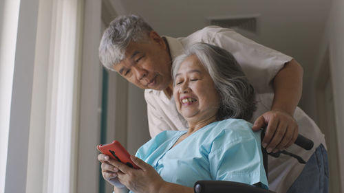 Side view of doctor examining patient at home