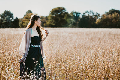 Woman standing on field