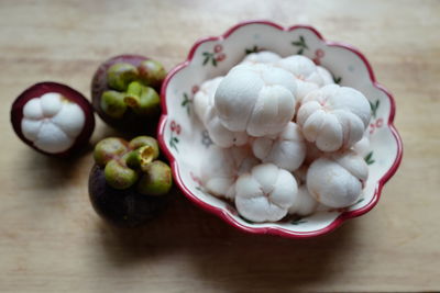 High angle view of fruits in plate on table
