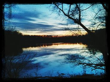 Reflection of clouds in lake at sunset