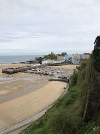 High angle view of buildings by sea against sky