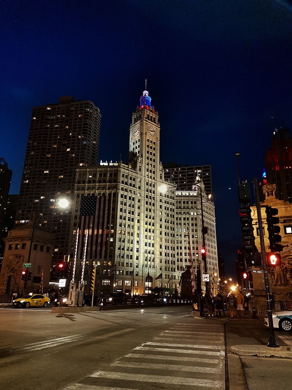 illuminated, building exterior, architecture, built structure, night, city, skyscraper, outdoors, travel destinations, sky, transportation, tall, low angle view, no people, modern, cityscape