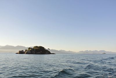 Scenic view of sea against clear sky