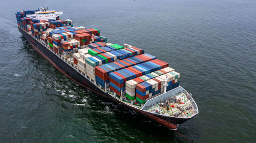 Aerial view container ship cargo freight shipping maritime vessel, global business supply chain.