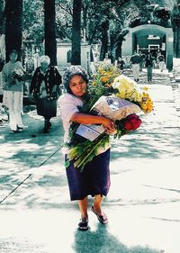 Full length of woman standing on flower