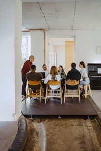 Creative male and female business people in meeting at startup company