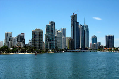 View of cityscape against blue sky