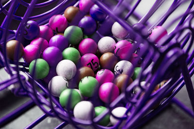 High angle view of multi colored eggs in basket