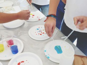 High angle view of people performing scientific experiment