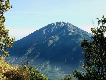 Scenic view of snowcapped mountains against clear sky
