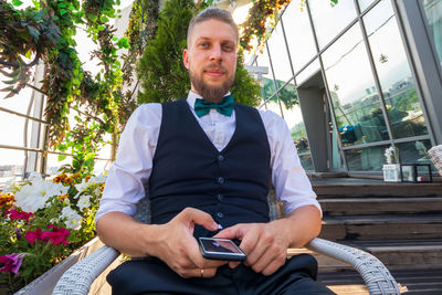 Portrait of young man using mobile phone