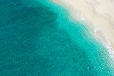 High angle view of surf on beach