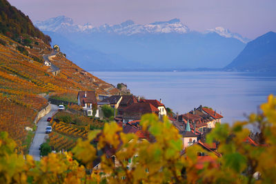 Scenic view of town against mountains