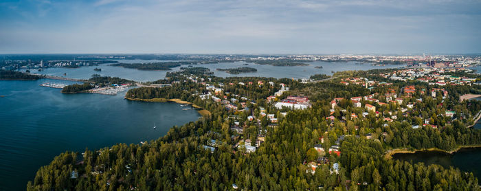 High angle view of sea and buildings against sky