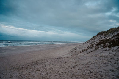 Scenic view of beach against sky