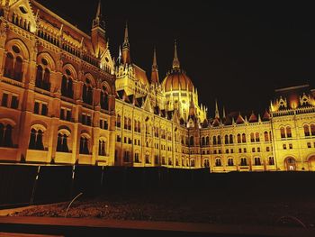 Low angle view of illuminated building at night