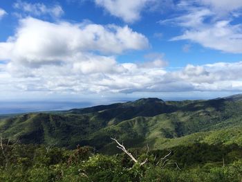 Scenic view of landscape against cloudy sky