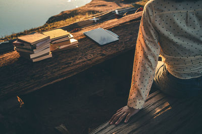 High angle view of woman sitting on table