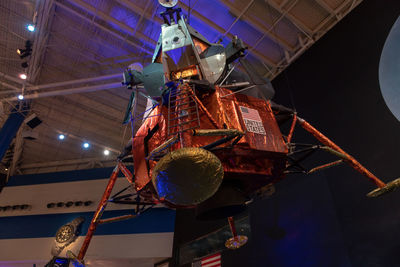 Low angle view of illuminated lighting equipment in museum