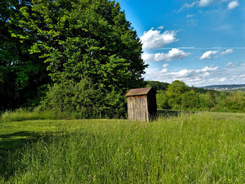 Built structure on field against sky