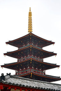 Low angle view of pagoda against sky