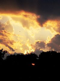 Low angle view of dramatic sky during sunset