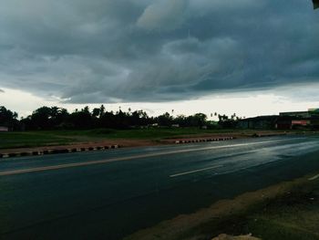 Scenic view of field against sky during rainy season